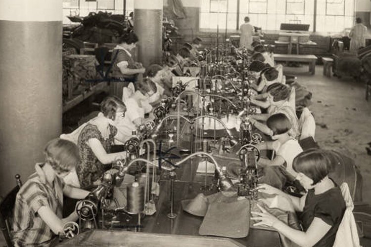 Workers stitching garments at Richman Brothers factory in 1927